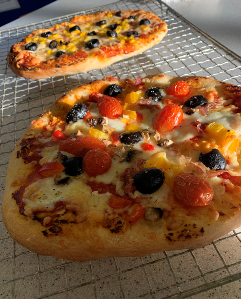 Photo of two pizzas made by students